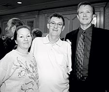 Dr. Todd Kuiken (at right) with his patient Jesse Sullivan and Sullivan's wife, Carolyn